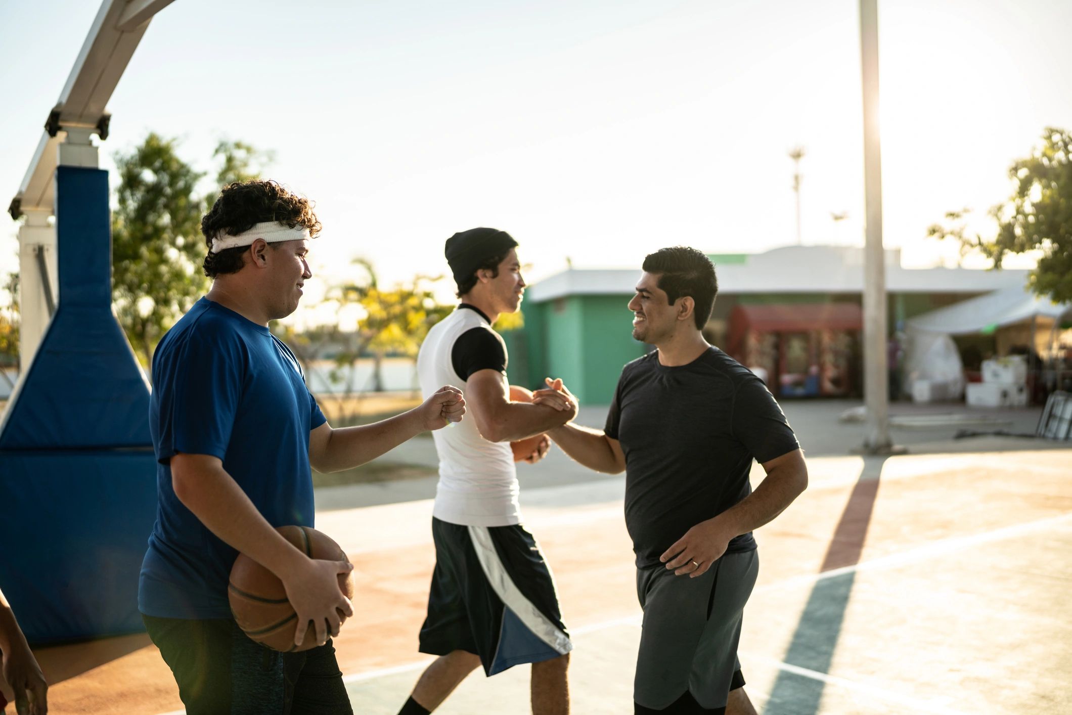 Students greeting on a basketball court