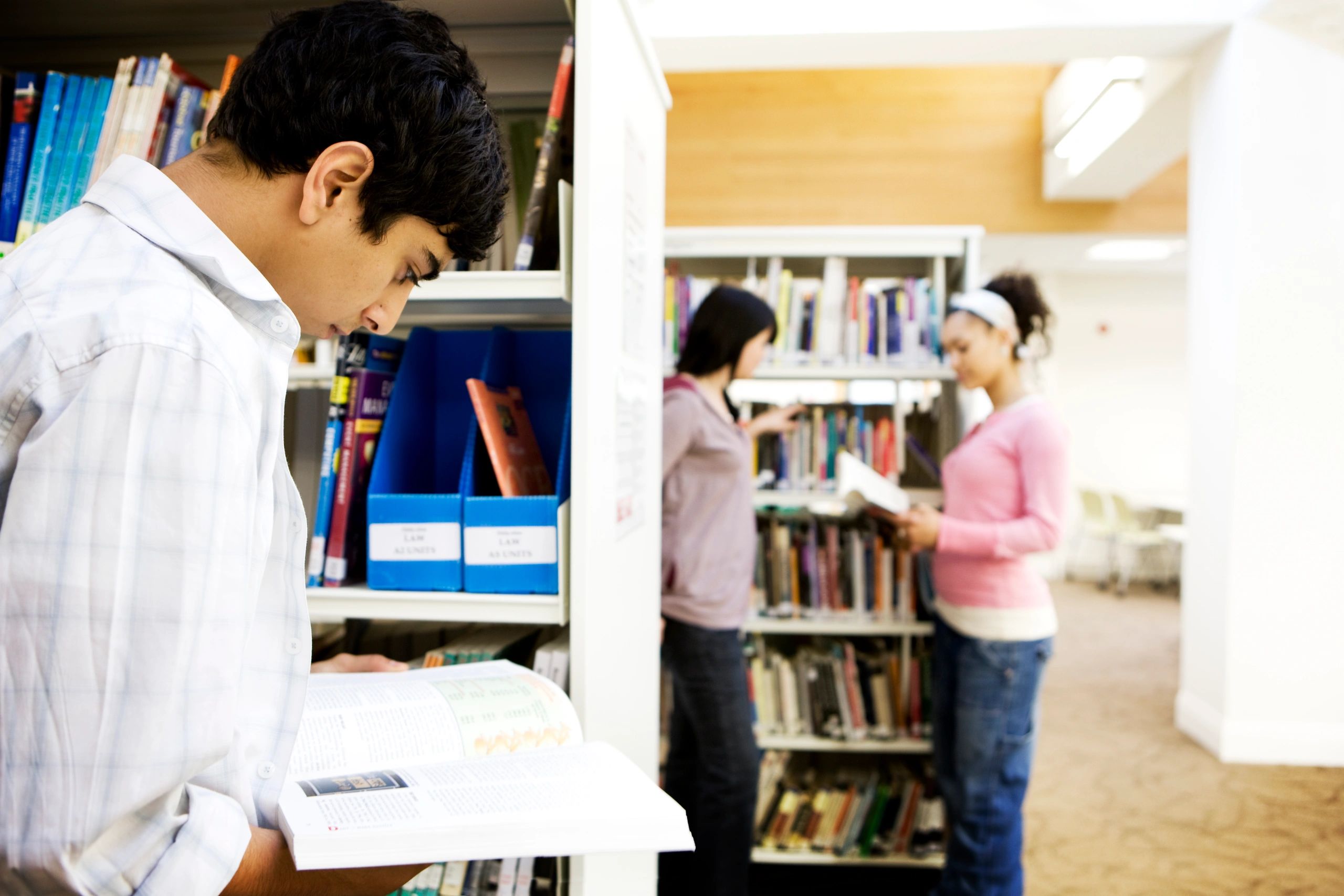 Students studying in a college library
