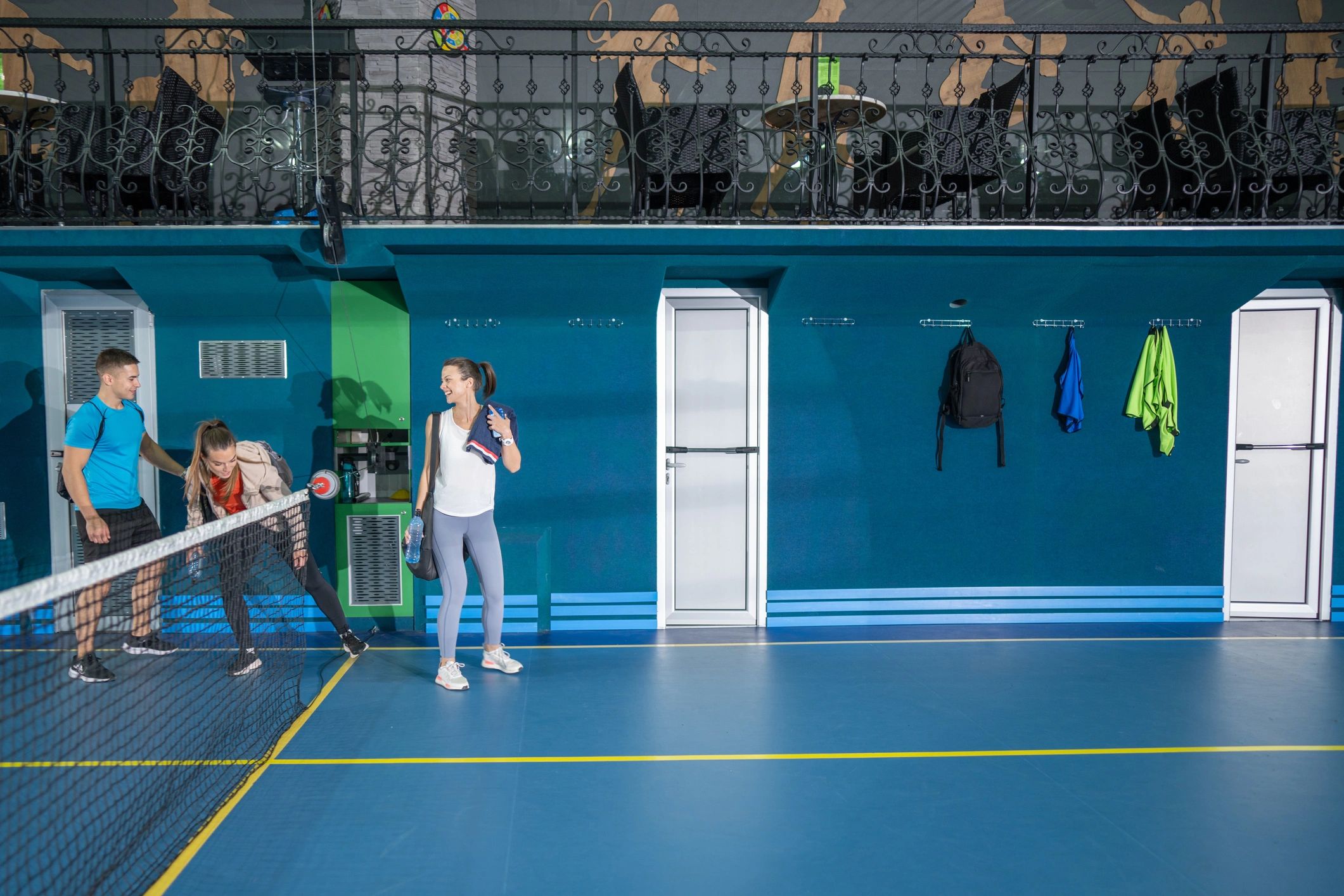Students entering an indoor sports hall ready for training