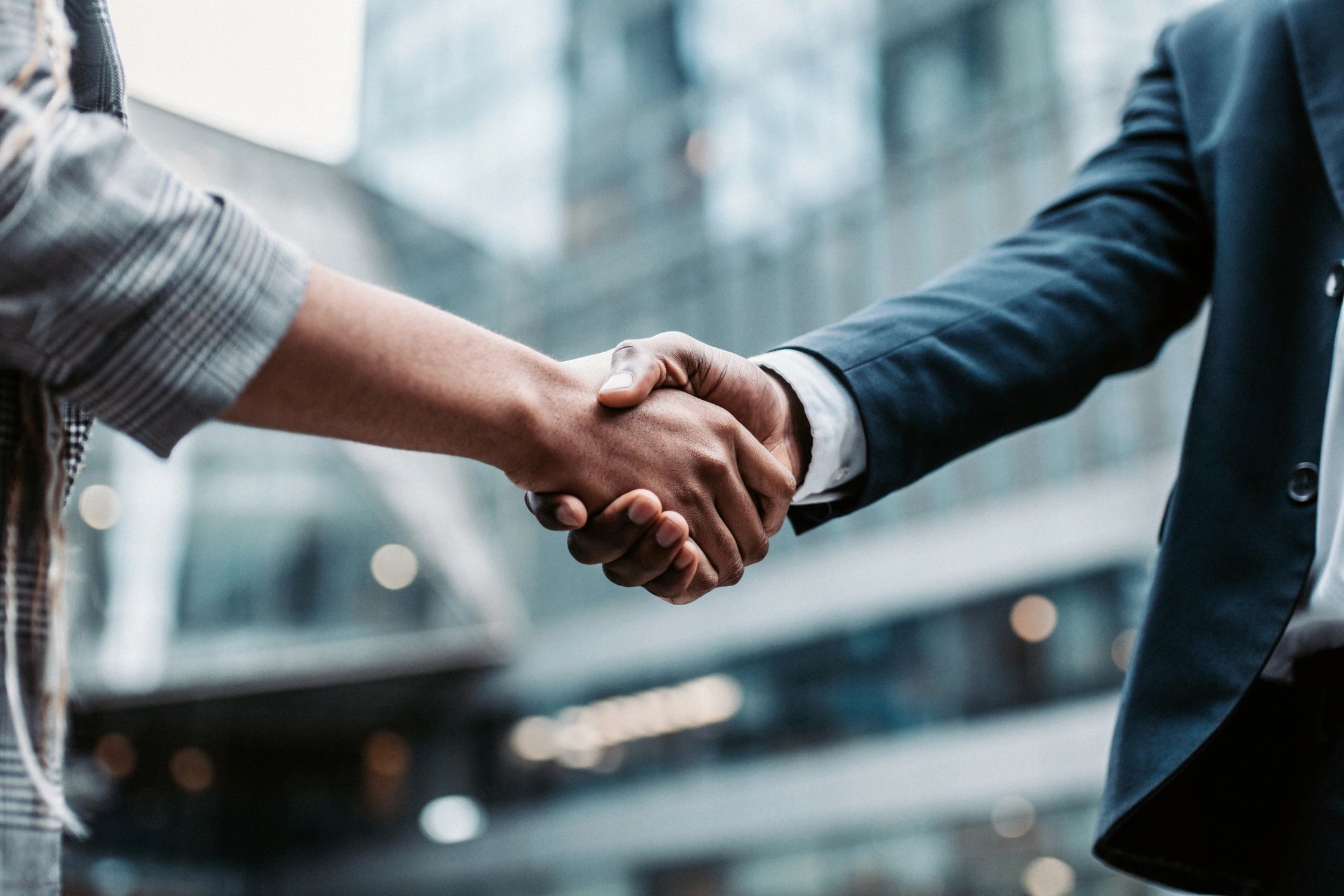 Corporate handshake representing industry partnership