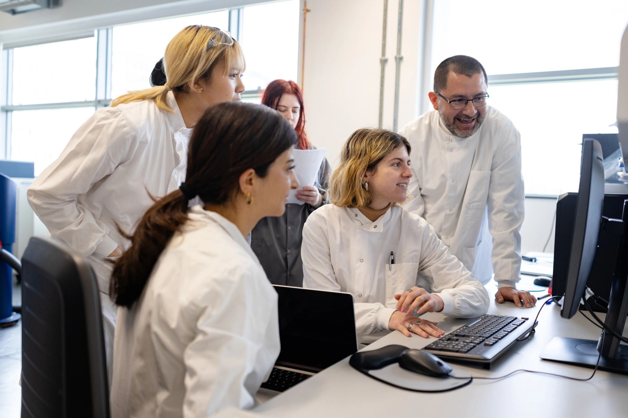 Students conducting scientific research in a laboratory