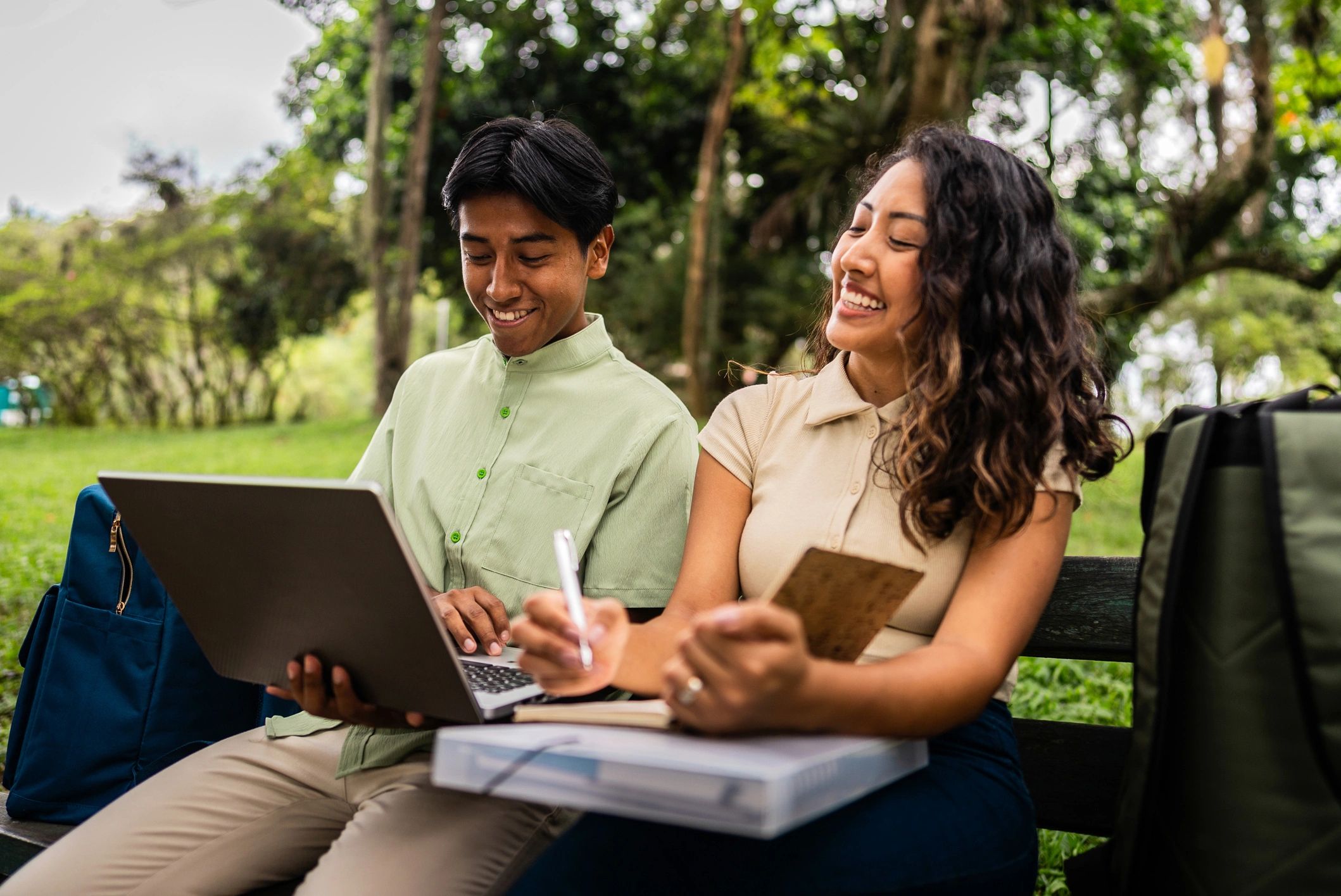 Students using a laptop to complete an online form