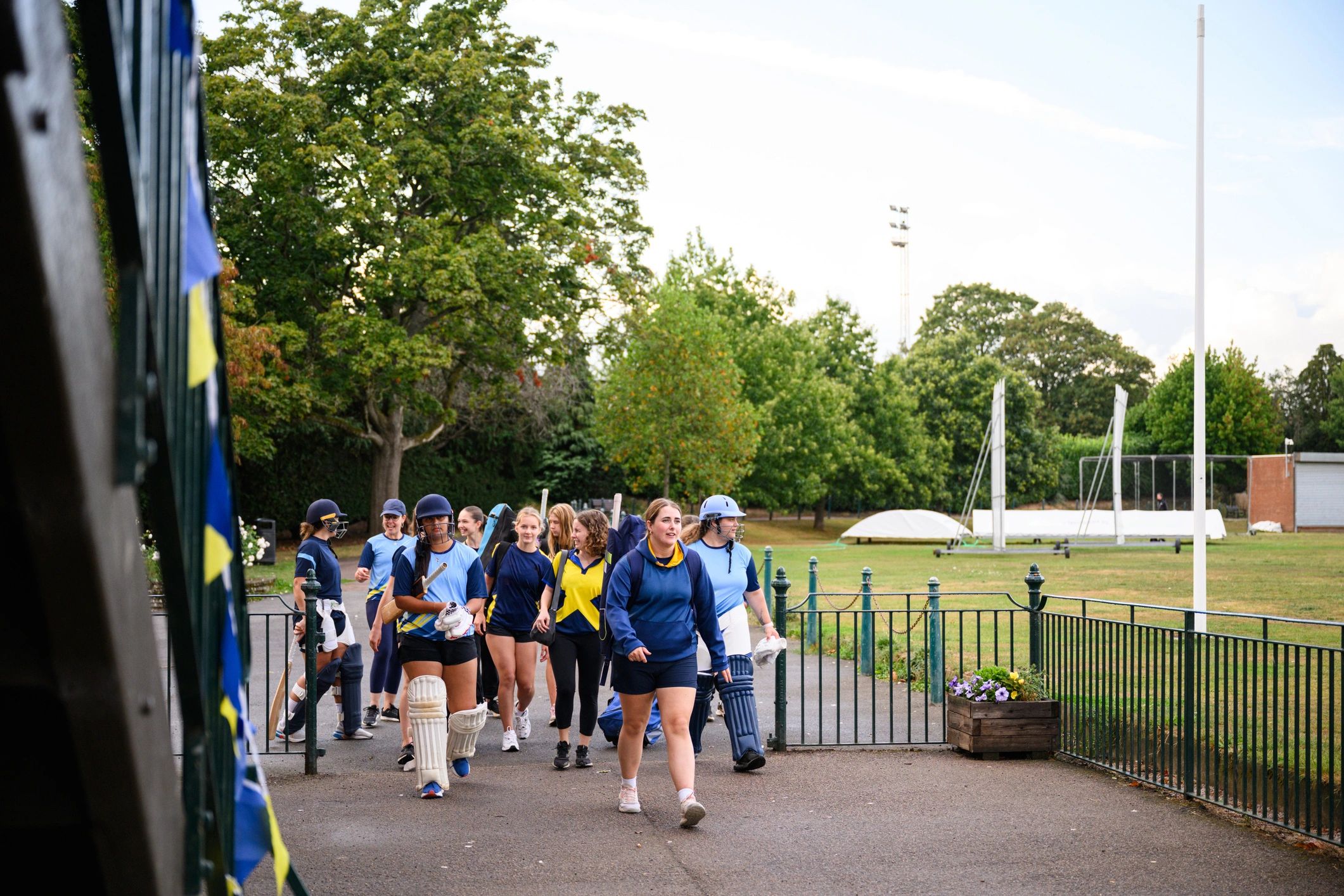 Women’s cricket team walking together on the ground