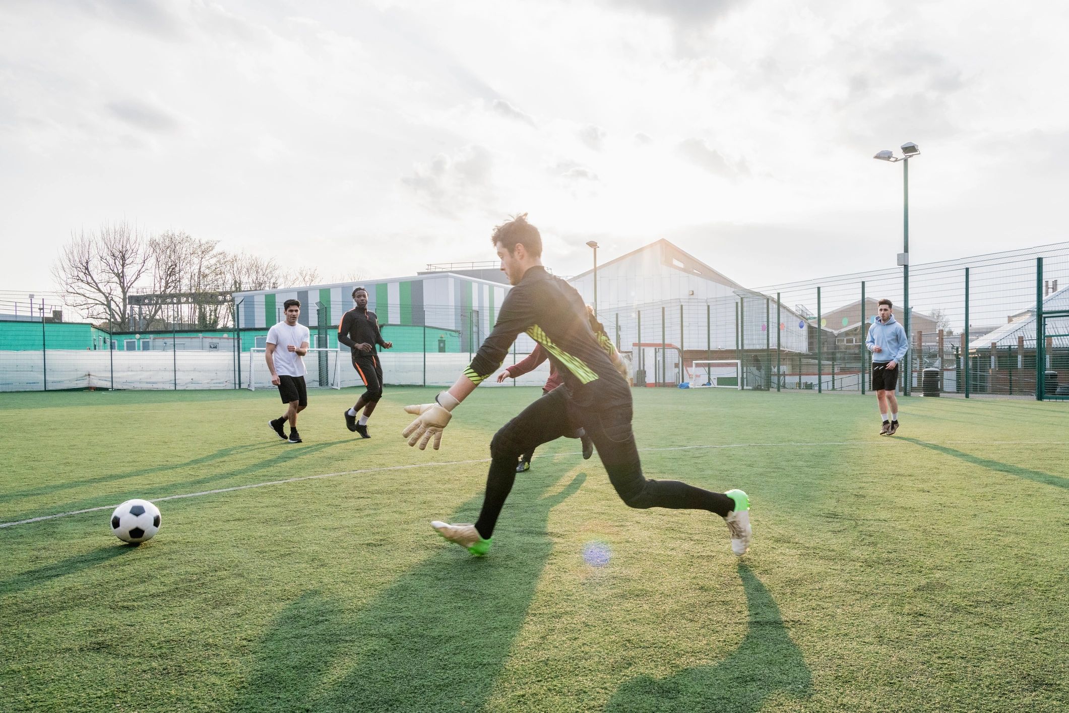 Students playing football on a field